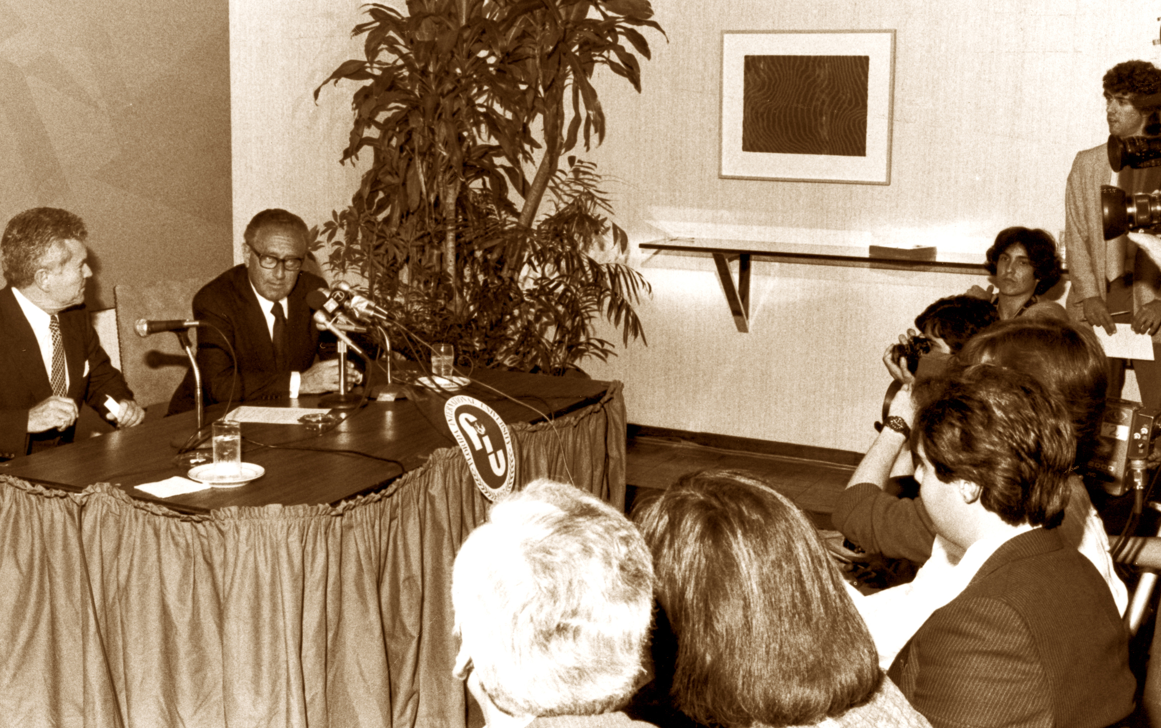 Gregory Wolfe and Henry Kissinger at Florida International University